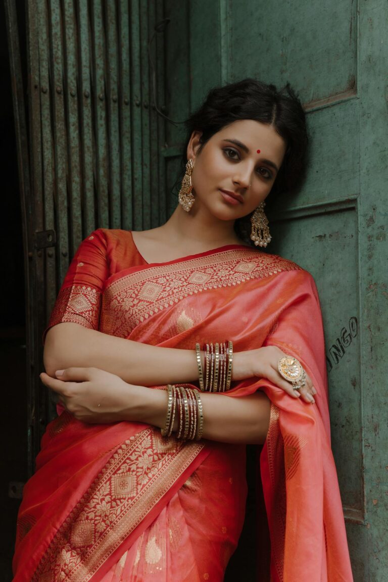 Elegant Banarasi sarees with intricate gold zari work, symbolizing traditional Indian craftsmanship.